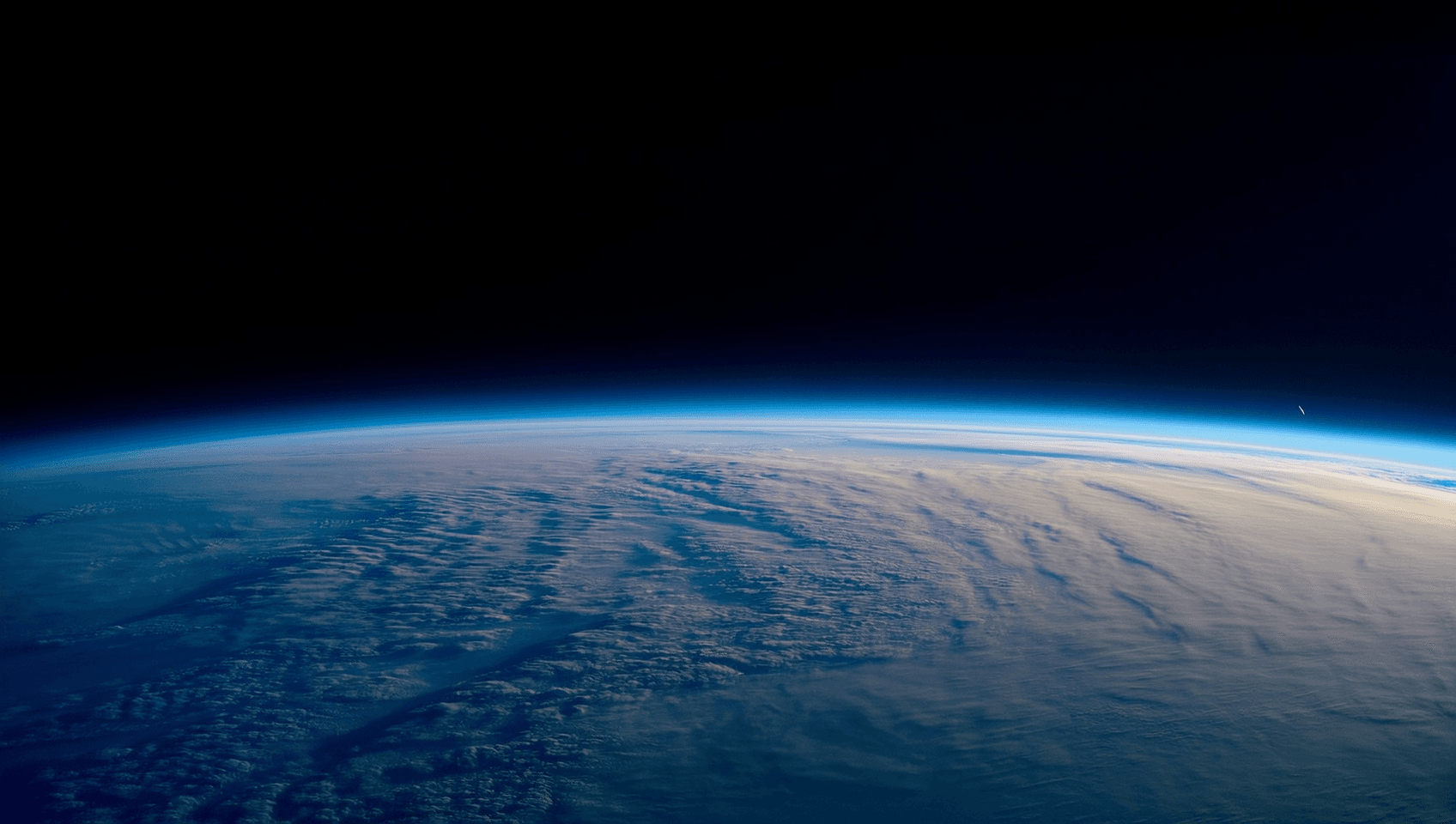 Approved Earth atmosphere profile plate with blue limb and cloud texture.